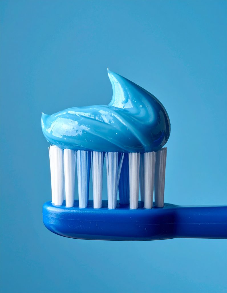 Firefly_blue toothpaste on a blue toothbrush in blue background 950487 (2)